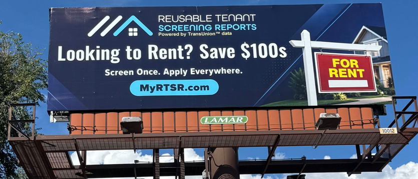 Outdoor billboard advertising tenant screening with the message 'Looking to Rent? Save $100s' and a nearby 'For Rent' sign on the right.